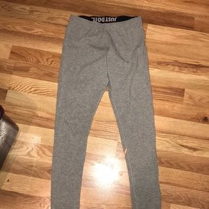 Small Grey Nike leggings with orange/white logo